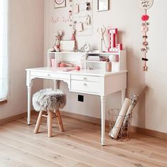 a white desk and chair in a room