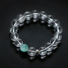 This bracelet features mesmerizing white crystal beads, each carefully selected for their clarity and luster, and the stretch design is comfortable and easy to wear, ensuring a perfect fit for any wrist size, whether worn alone for a minimalist look, or Stack with other bracelets for a more dramatic effect Gemstone:White Crystal,Pink Crystal,Amethyst,Green Cat Eye,Aquamarine Gemstone Dimensions:10mm Length:Small 130-140mm,Large 150-160mm,170-180mm(Micro elastic） Weight:22g-23g Green Cat Eye, Crystal Amethyst, Green Cat, Edison Pearls, Aquamarine Gemstone, White Crystal, Beaded Stretch Bracelet, Mongolia, Pink Crystal