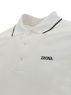 Cotton polo shirt by zegna, classic ribbed collar with contrasting profile, tone-on-tone front buttons, short sleeves with contrasting profiles, iconic brand signature embroidered in contrast on front, regular fit. Composition: 95% % Cotton, 5% % Elastane Classic Top With Collared Neckline And Embroidered Logo, Classic Top With Embroidered Logo And Collared Neckline, Elegant White Polo Shirt With Ribbed Collar, Classic Collared Polo Shirt With Logo Detail, Classic Polo Shirt With Logo Detail, Classic Polo Shirt With Embroidered Logo For Work, Classic Business Polo Shirt With Ribbed Collar, Classic Collared Tops With Logo Detail, Elegant Top With Contrast Polo Collar