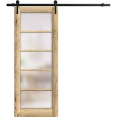 an open wooden door with glass panels and black metal bars on the bottom, in front of a white background