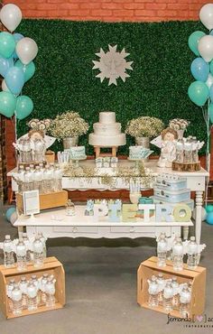 a table with cake and balloons on it