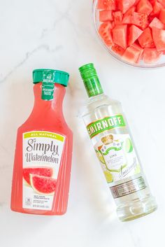 watermelon juice and other ingredients on a white counter top, including a bottle of simply watermelon