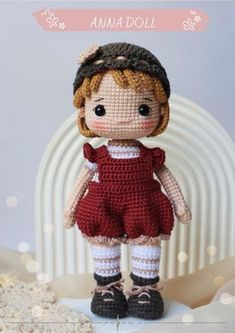 a crocheted doll is standing in front of a white background with the words annie doll on it