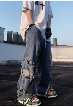 Rock a bold streetwear look with these Ripped Baggy Distressed Jeans—crafted for your alt aesthetic and Y2K streetwear fits, they feature an elastic drawstring waistband for a comfortable fit and unique rips and distress details for an edgy style. Edgy Ripped Baggy Pants, Oversized Ripped Casual Jeans, Casual Oversized Ripped Jeans, Oversized Ripped Bottoms For Streetwear, Casual Ripped Streetwear Bottoms, Baggy Ripped Grunge Pants, Baggy Distressed Pants For Streetwear, Grunge Bottoms With Holes For Streetwear, Grunge Streetwear Bottoms With Holes