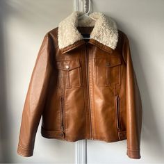 I'm Selling A Brand New Brown Leather Jacket With White Fur Trim, Button-Up And Zipper, Plus A Stylish Collar. Ships In 1-3 Business Days. I Would Pair With Jeans And Boots Or A Dress And Ankle Boots! Winter Collared Leather Jacket With Snap Buttons, Collared Leather Jacket With Snap Buttons For Winter, Casual Winter Leather Jacket With Buttons, Casual Leather Jacket With Buttons For Winter, Casual Leather Jacket With Snap Buttons For Winter, Winter Leather Jacket With Buttons, Trendy Winter Leather Jacket With Button Closure, Trendy Leather Jacket With Button Closure For Winter, Casual Winter Leather Jacket With Button Closure