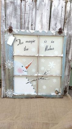 an old window is decorated with snowmen and the words, no magic in the making