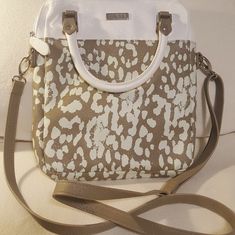 So Cute.. Faux Leather Print With Handbag Handles And Removable, Adjustable Shoulder Strap. Inside Has Card Slots On One Side And Zipper Compartment On Other. The Back Also Has A Zipper Compartment. White Satchel With Adjustable Handle For Everyday Use, Everyday White Satchel With Adjustable Handle, Trendy White Satchel For Day Out, White Summer Satchel With Detachable Strap, White Satchel With Adjustable Strap For Day Out, White Satchel With Detachable Strap For Summer, White Satchel Bag For Day Out, White Spring Satchel With Top Carry Handle, Spring White Satchel With Top Carry Handle