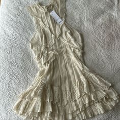 Brand New Off White Ruffle Dress - Great For Bachelorette Or Southern Theme Flowy Cream Dresses With Ruffles, Elegant Cream Ruffle Dress For Summer, Chic Cream Ruffle Dress For Spring, Flowy Cream Dress With Ruffles, Cream Ruffle Dress With Ruffle Hem For Spring, Cream Ruffle Hem Dress For Daywear, Spring Off White Dress With Ruffles, Off White Ruffled Spring Dress, Fitted Ruffle Dress With Lace Trim For Summer