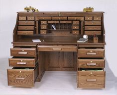 a wooden desk with drawers on top of it