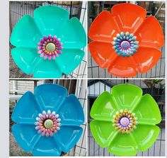 four different colored flower shaped plates with flowers in the center and on each one side