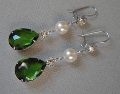 Emerald Green Earrings Long Dangle Pear Shape Rhinestone and a Swarovski Pearl wedding bridal St Patrick's Day jewelry These Bridal Earrings in Emerald Green Crystal Rhinestone are so pretty with a Long Green Pear Shaped Drop that measures a total of 2 1/2 inches long. Made with a Swarovski Pearl in your choice of color either White (shown) or Cream Ivory, these also have a French hook with sparkling Rhinestone on the top. Comes in a Gift Box and ready to give. Perfect wedding bridal or gift! To Green Crystal Bridal Earrings For Wedding, Elegant Green Crystal Earrings For Weddings, Green Crystal Rhinestone Earrings For Wedding, Green Rhinestone Crystal Earrings For Wedding, Wedding Green Crystal Rhinestone Earrings, Emerald Green Earrings, Pearl Wedding, Green Earrings, Swarovski Pearls