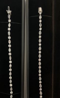 This unique and stunning tennis bracelet features DEF VVS/VS marquise and round lab diamonds on 14k white gold and a box clasp with a single butterfly style closure. Carats are calculated based on 7 inch length= 6.5 carats total weight. If you would like a sample of this bracelet in crystalline on silver instead of diamonds on white gold, please contact us and we will invoice it at $300. The crystalline and silver version of this bracelet has a double butterfly closure on the side of the box cla Luxury Marquise Diamond Bracelet For Formal Occasions, Luxury Marquise Cut Diamond Bracelet For Formal Occasions, Luxury Marquise Cut Diamond Bracelet For Formal Events, Formal Marquise Diamond Bracelet With Diamond Accents, Formal Marquise Diamond Bracelet With Accents, Diamond White Marquise Jewelry For Evening, Evening Marquise Diamond White Jewelry, White Marquise Diamond Bracelet For Formal Occasions, Luxury Marquise Tennis Bracelet With Prong Setting