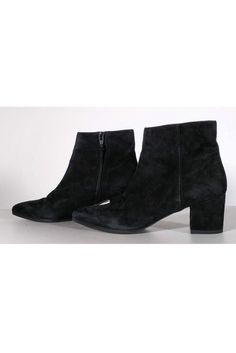 Stylish ankle booties made in luxe suede. They feature a chic pointed toe and classic blocked heel. Perfect to wear with a sweater dress and tights. Size 6.5 M Suede upper Leather lining Manmade sole Made in Spain Stacked heel Side zippers Light wear on soles Some wear/marks on suede Heel height 2.25" High Ankle Suede Booties For Fall, Chic Winter Booties With Reinforced Heel, Winter Booties With Reinforced Heel Medium Width, Winter Booties With Reinforced Heel And Medium Width, Chic Winter Boots With Stacked Heel, Trendy Formal Winter Boots, Winter Suede Boots With Stacked Heel, Winter Heeled Boots With Stacked Heel For Night Out, Winter Workwear Pointed Toe Boots