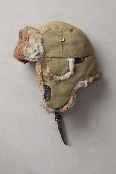 Winter waits at a distance when you're wearing this rugged trapper hat. Our canvas trapper offers the warmth and versatile good looks that take you through winter in comfort. The tightly woven cotton canvas with quilted cotton lining resists wind and cold. And the ultra-soft rabbit fur trim looks great and feels incredible, whether you wear the ear flaps down or tied up with the leather chin strap. Adjustable Winter Adventure Hat, Outdoor Brimmed Hats With Plush Lining, Windproof Aviator Hat For Outdoor, Cotton Hats For Outdoor Fall Activities, Military Hats For Winter Outdoor Activities, Winter Military Hat For Outdoor Activities, Military Style Winter Hat For Outdoor Activities, Winter 5-panel Outdoor Hat, Winter Cotton Brimmed Hat