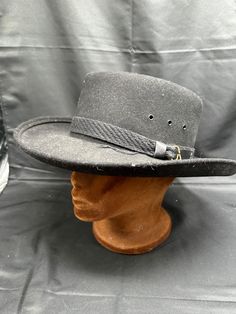 Vintage J-hats Americana Collection Western Wool Felt Flat Top Cowboy Hat Large Add some Western flare to your outfit with this vintage J-hats Americana Collection cowboy hat. Crafted with 100% wool, this black hat is perfect for any occasion, from rodeos to concerts. The flat top design adds a unique touch to the classic western style, making it a standout piece in your collection. The hat is from the 1980s, adding to its vintage charm. It's a large size, making it a comfortable fit for everyon Vintage Flat Brim Fedora For Outdoor, Vintage Adjustable Hats For Country Events, Vintage Felt Hat With Curved Brim For Outdoor, Retro Short Brim Hat For Western-themed Events, Vintage Fedora Hat For Outdoor, Western Style Boater Hat With Short Brim For Winter, Western Style Winter Boater Hat With Short Brim, Retro Adjustable Hat For Rodeo, Vintage Adjustable Fedora For Country Events