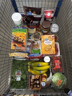 a shopping cart filled with food and condiments