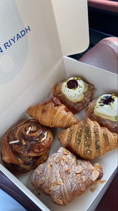 a box filled with pastries sitting on top of a table