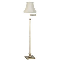 a floor lamp with a white shade on it