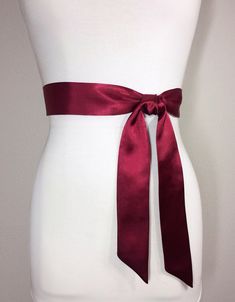 "Narrow Burgundy Sash, Burgundy Satin Sash Maroon Sash, Wine Sash Belt Wrap Belt, Waist Sash, Wedding Sash Bridal Sash, Dress Sash Satin Swank Now in a narrow version, this Satin Swank® reversible waist sash is the perfect finishing touch for your wedding, bridesmaid, or special occasion dress, or just the right piece to add instant polish to your dress or top. Depending on your waist size and the length you choose, you can wrap the sash around your waist once or up to three times. You decide wh Satin Ribbon Bridal Belt For Parties, Wedding Sash With Tie Back, Satin Sash With Bow For Bridesmaids, Bridesmaid Sash With Satin Bow, Bridesmaid Satin Sash With Satin Bow, Bridesmaid Satin Sash With Bow, Formal Sashes With Matching Belt, Satin Sashes For Bridesmaids, Satin Bridal Belt For Bridesmaids