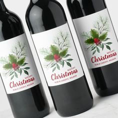 three bottles of christmas wine on a table