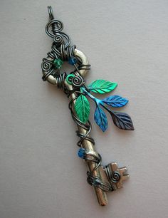 Hematite Wire Wrapped Key Pendant with Green/Blue Leaves-- hand inked leaf sprig, hematite wire, Swarovski crystals. $56.00, via Etsy. Key Crafts, Old Keys, Fairy Tree, Key Jewelry, Magical Jewelry, Vintage Keys, Key To My Heart, Key Necklace, 판타지 아트