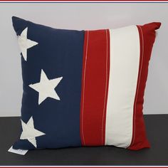 a red, white and blue pillow with stars on it