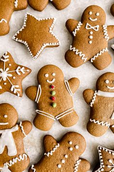 several ginger cookies are arranged on a sheet of paper