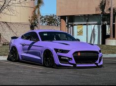 a purple sports car parked in a parking lot