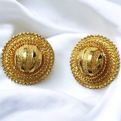 "Georgeous Egyptian Revival Gold plated statement Earrings are a vintage lovers dream.  They are impeccably made, they do have a little weight but comfortable on the ears. Pre-owned they come in excellent condition. Measurements  1 3/8\" * 1 3/8\"" Vintage Brass Earrings For Celebrations, Vintage Earrings With Intricate Design For Celebrations, Vintage Gold Earrings For Celebration, Vintage Gold Celebration Earrings, Vintage Yellow Gold Festive Earrings, Vintage Gold Plated Wedding Earrings, Traditional Gold Clip-on Earrings, Vintage Earrings With Intricate Design For Festivals, Vintage Drop Plug Earrings For Festivals