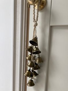 bells hanging from the side of a door