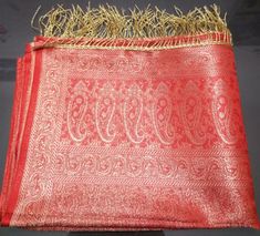 "This Stole is made of woven fabric and is decorated with Brocade design and Banarasi Stoles are characterised by brocade borders & pallus.They often have woven buti or jall on the body. Stole length: 72\"(inch) Stole Width: 22\" (inch) Material:Art Silk Color:As shown in the picture Dry Clean." Red Art Silk Shawl With Zari Work, Traditional Brocade Shawl For Festivals, Red Silk Shawl With Zari Work, Red Shawl With Traditional Drape For Festivals, Red Silk Shawl For Festive Occasions, Festive Red Silk Shawl, Red Shawl With Pallu For Traditional Ceremonies, Red Shawl With Traditional Drape For Festive Occasions, Brocade Shawl For Wedding With Traditional Drape