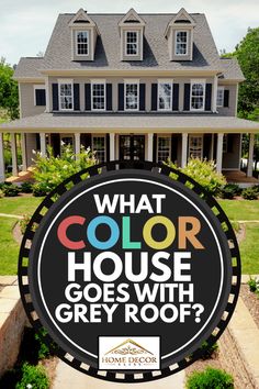 a sign that says what color house goes with grey roof? in front of a large home