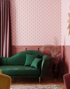 a living room with pink walls and green couches in front of a wallpapered background