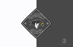 an eagle emblem is shown on the side of a gray and white background with black lettering