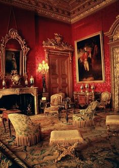 an ornately decorated living room with red walls