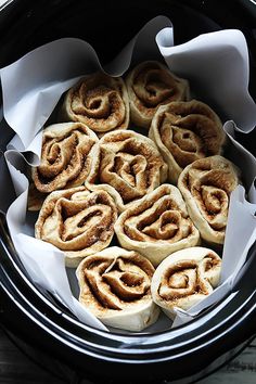 some cinnamon rolls are sitting in the crock pot and ready to be cooked for dinner