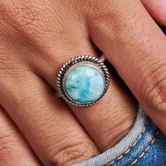 The ring for everyone! This dainty Larimar ring is set in 925 sterling silver with rope detailing around the stone and a studded band. Simple and sweet but with a pop of color, this is one of our best selling styles, that anyone will adore! Gemstone: Larimar  Material: 925 Sterling Silver Natural Blue Larimar  925 Solid Sterling Silver Statement Ring Stone Size  -08X08 MM (Approx) *the stones may vary slightly in shape, size and color. ✦Ring Size (US) - Please select size option from drop down menu. ✦Metal: Select from Drop down Menu ✦Stone - Larimar   (stone size can be customize on Demand) Our products are totally handmade and made with high quality gemstones and sterling silver. -If you believe in buying top quality products for yourself and for your family and friends   NOTE:- Oval Silver Larimar Turquoise Ring, Oval Larimar Gemstone Rings, Silver Larimar Oval Ring, Unique Silver Larimar Rings, Nickel-free Larimar Silver Jewelry, Larimar Rings, Larimar Stone, Statement Ring Silver, Rings Simple