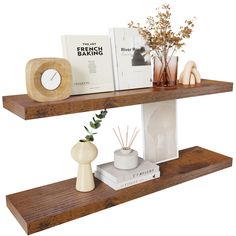 two wooden shelves with books and vases on them