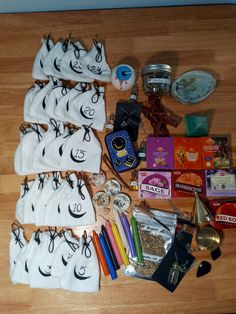 the contents of a bag laid out on a wooden table with scissors, candy and other items