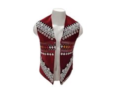 ~ Step into the cultural beauty of Afghanistan with our Afghan Traditional Velvet Waistcoat.  Created by Afghan women, each waistcoat is made with care, featuring a beautiful maroon velvet and a unique patchwork design that shows off Central Asian traditions.  This waistcoat is for everyone, adding a touch of tribal patterns and boho style to any occasion. Wear this handmade treasure to celebrate Afghan culture and show your authentic style!  PLEASE NOTE: Each waistcoat is 100% customized and ta Traditional Embroidered Sleeveless Outerwear, Traditional Sleeveless Vest Outerwear, Traditional Sleeveless Vest For Festivals, Traditional Sleeveless Vest For Festive Occasions, Traditional Sleeveless Festive Vest, Red Embroidered Sleeveless Vest, Traditional Sleeveless Nehru Jacket For Festivals, Traditional Red Vest For Festival, Traditional Fitted White Vest