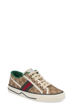 Gucci serves up some heritage style with a low-top sneaker branded with Web striping, double-G sole embossing and retro sport labels at the tongue and footbed. Style Name:Gucci Tennis 1977 Platform Sneaker (Women). Style Number: 6002528. Available in stores. Gucci Low-top Sneakers With Logo, Gucci High-top Logo Sneakers, Gucci High-top Sneakers With Logo, Gucci Sneakers With Logo And Round Toe, Gucci High-top Sneakers With Logo Print, Gucci Sneakers With Logo, Sporty Gucci Sneakers With Logo Print, Designer Gucci Platform Sneakers With Round Toe, Gucci Designer Platform Sneakers With Round Toe