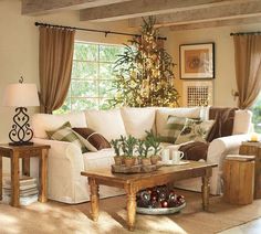 a living room filled with furniture and a christmas tree