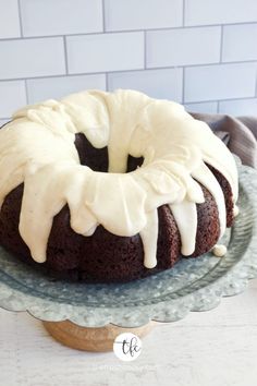 a bundt cake with icing on a plate