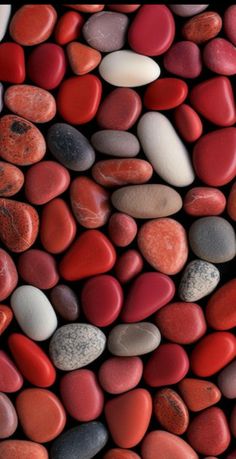 red, white and black rocks are arranged together