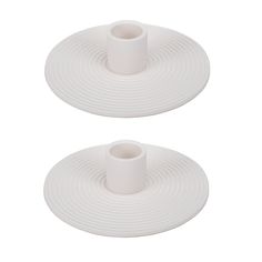 two white plates sitting on top of each other