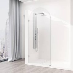 a bathroom with a walk in shower next to a window and a cityscape