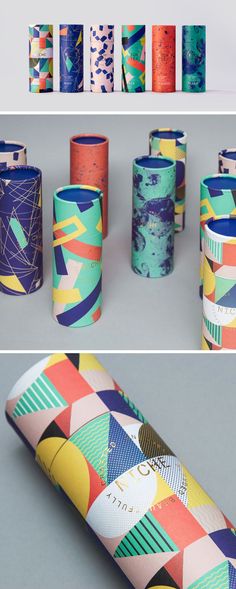 several rolls of colorful wrapping paper sitting on top of each other