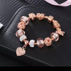 Start your very own moments with this sleek snake chain charm bracelet in Rose Gold , a 14k rose gold-plated unique metal blend.The perfect canvas for your creativity,this hand- finished bracelet can be styled in countless ways.Your desired charms ,wear it on it's own for a simple understated look or stack it with contrasting bracelets for a fun play on textures --the only limit is your imagination! Rose Gold Snake Chain Bracelet, Trendy Rose Gold Metal Charm Bracelet, Rose Gold Bracelets With Snake Chain For Gift, Rose Gold Snake Chain Bracelet As Gift, Trendy Snake Chain Bracelets As Gifts, Trendy Snake Chain Bracelet For Gifts, Metal Snake Chain Charm Bracelet Gift, Metal Charm Bracelet With Snake Chain As Gift, Trendy Rose Gold Charm Bracelet