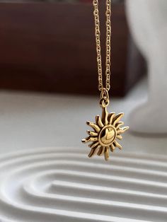 This dainty Sun necklace will help you attract brighter days and great energy☀️🌞The sun sign is still a powerful and enduring symbol for spirituality, life, and energy. Its ongoing significance as a symbol of hope, renewal, and divinity is demonstrated by its appearance in a wide range of cultures and belief systems. 18k gold plated over sterling silver -Height- approximately 17mm -Width -approximately 17mm -Waterproof  -Hypoallergenic  Perfect for everyday wear  All sales are final Thank You f Celestial Sun Design Necklaces As A Gift, Celestial Sun Design Necklaces For Gifts, Celestial Sun Design Necklaces As Gifts, Sun-shaped Jewelry With Sun And Moon Design For Gift, Celestial Style Necklaces With Sun Design For Gifts, Everyday Celestial Pendant Charm Necklaces, Celestial Sun Design Pendant Necklace, Spiritual Sun And Moon Design Necklace As Gift, Dainty Sun And Moon Charm Necklaces As A Gift