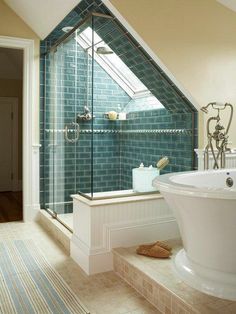 a bathroom with a skylight and a bathtub